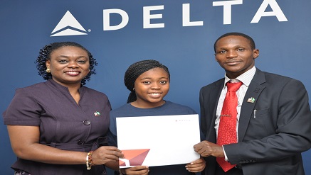 (L-R) E. T. Sefia, GSA manager, Delta Air Lines, presenting a free ticket to the US to Miss Karimat Sowemimo, winner, Secondary Schools Category, National Travel Essay Competition (NTEC 2013/14); and Ewos Iroro, founder, NTEC during a courtesy visit to the airline's office recently.